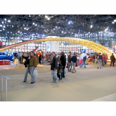 At the New York International Auto Show at the Javits Center, Saturn’s eye-grabbing booth for its Aura concept car consisted of a wide arch. Lights mounted on the ceiling change the color of the arch throughout the show.