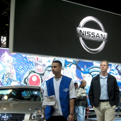 Nissan took a museumlike approach with its booth, decorating the wall with a large graffiti piece.