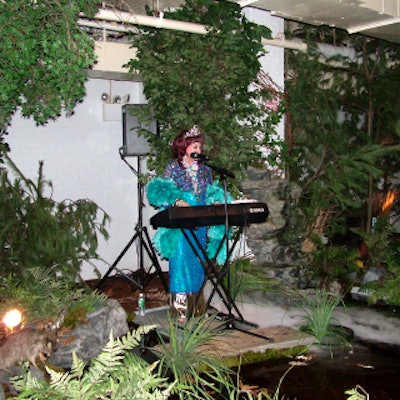 Downstairs, Cuban crooner Margarita Pracatan sang while playing a synthesizer.