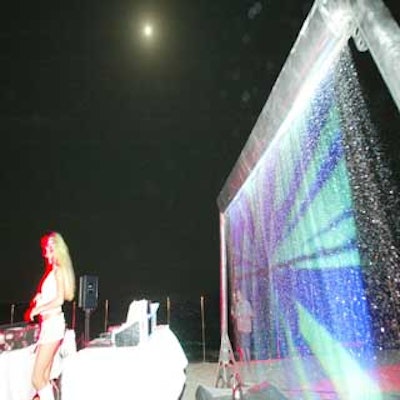 A video of fire and water images played against a water screen that stood behind the stage housing DJ Snezana's booth.