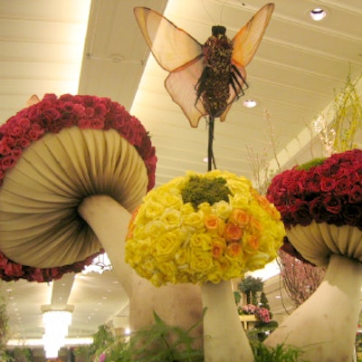 Jorge Cazzorla of Celebrate Flowers created a large cluster of mushrooms for Macy’s Flower Show. The three mushrooms’ caps were covered with more than one thousand roses, and five butterflies carpeted with small roses were suspended overhead.