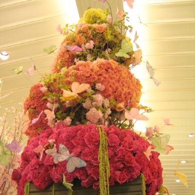 A swarm of butterflies surrounded DeJuan Stroud’s spiraling tower fashioned out of carnations and roses.