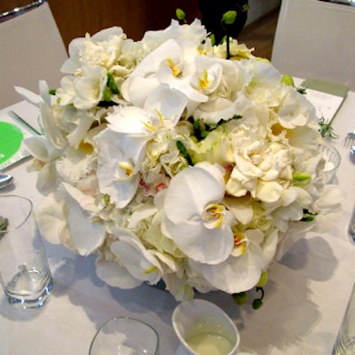 James François-Pijuan designed big, round floral arrangements of white orchids, roses, and hydrangeas.