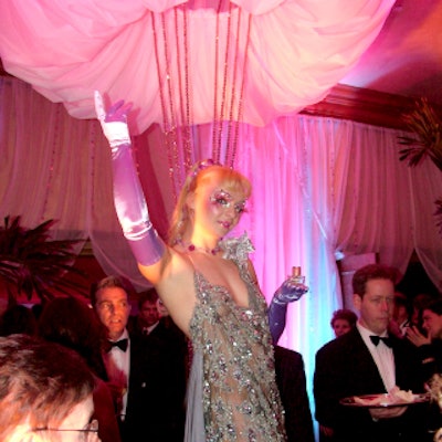 At the Fragrance Foundation’s FiFi awards, burlesque model Julie Atlas Muz posed with perfume bottles on a pedestal at the entry to the Hammerstein Ballroom.