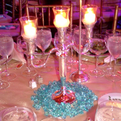 Candelabras substituted for floral centerpieces on the tabletops.