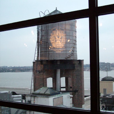 Across the West Side Highway, a water tower provided the backdrop for a 10 Cane logo projection.