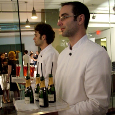 Sponsor Moët provided mini champagne bottles with straws.