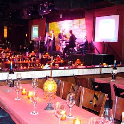 A cabaret-style set-up inside the B. B. King Blues Club & Grill set the stage for the BiZBash Event Style Awards show. Iridescent red-orange linens from White Plains Linens covered the tables, which were topped with silver champagne buckets and andle lamps.