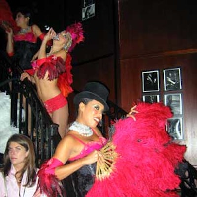 Ami Goodheart and her showgirls culminated a reception with a cabaret performance that proceeded down the room's curving staircase.