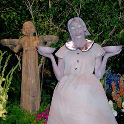 A living statue, based on the well-known image from the cover of the book Midnight in the Garden of Good and Evil, stood in the garden created for the benefit and mingled with guests throughout the night.
