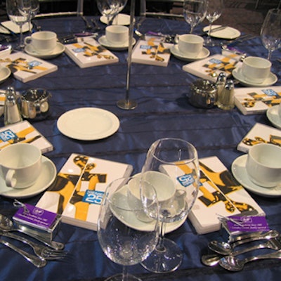 Simple blue organza from Around the Table made a perfect backdrop for silver accents from Chair-man Mills.