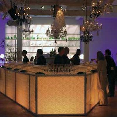 A huge, horseshoe-shaped bar, custom-designed by Showorkz to look like it was wrapped with lace, offered plenty of room for guests to get their drinks.
