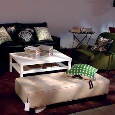 Multiple living room vignettes were decorated with chic accessories and enviable furniture, all with Domino-branded price tags.