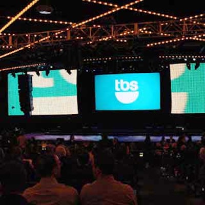 Giant LED curtains and TBS signage adorned the stage.