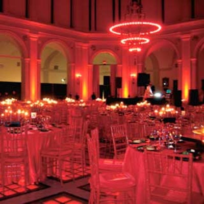 The all-red decor scheme by Richard Phillips of Events Soho included red-sequined tablecloths, red candle centerpieces atop alternating black and red platforms, and red chairs.