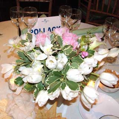 Stroud created simple floral centerpieces of pink peonies and white tulips.