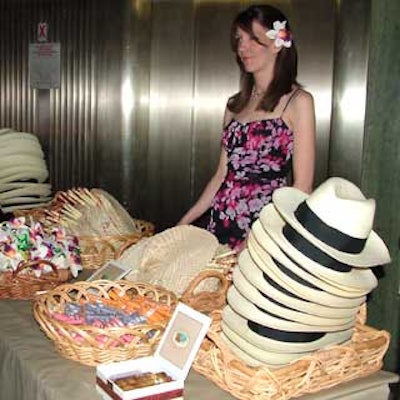 Guests could pick up hats, woven fans, faux orchid boutonnieres, and cigars to go with the event’s “Hemingway’s Cuba” theme.