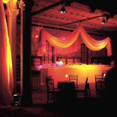 For the after-party, the bars were draped in soft fabric in shades of fuchsia and bright orange.