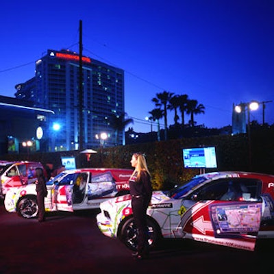 The entrance to the venue was a black carpet featuring an interactive car lounge, where guests could sit in Pioneer-decaled cars and sample the traffic-dodging technology.