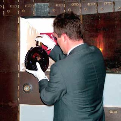 In the vault, brand ambassador Jason Bowden removed a magnum of Louis XIII from a safe to serve guests.