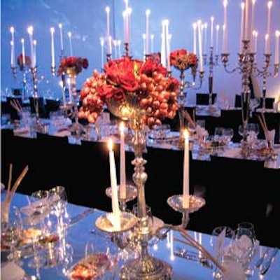 The dining area at the New York Academy of Art’s Tribeca Ball glittered with rows of tables holding tall silver candelabras interspersed with lower pieces adorned with roses and pendulous bunches of grapes.