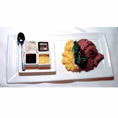 Creative Edge Parties served entrees of filet of beef with mascarpone polenta and sautéed spinach. The long rectangular plates held a collection of four sauces grouped in cube-like containers.