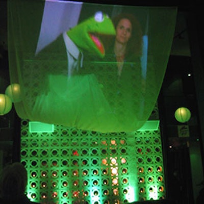 Images from The Muppet Movie were projected onto scrim hung from the venue’s ceiling.