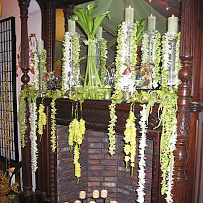 The fireplace was draped with strings of orchids and topped with a glass vase full of calla lilies.