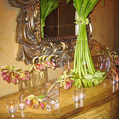 Another table was topped with calla lilies and orchid stalks in square vases.