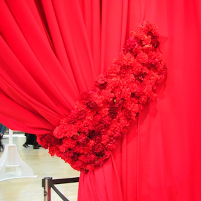 Event designer Nicholas Pinney of Nicholas Pinney Design hung a massive red drape with carnation tiebacks from Earthwork at the relaunch party for the Yorkdale shopping mall, called 'Flaunt It!'