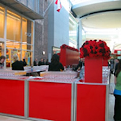 Contemporary Furniture's plexiglass bars were created in red and decorated with arrangements from Earthwork.