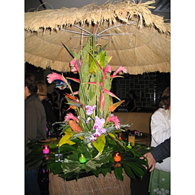 At Condé Nast Traveler’s Hot List party at Megu, tropical decor with orchids, ginger blooms, and thatched huts accented a Jamaica-theme area.
