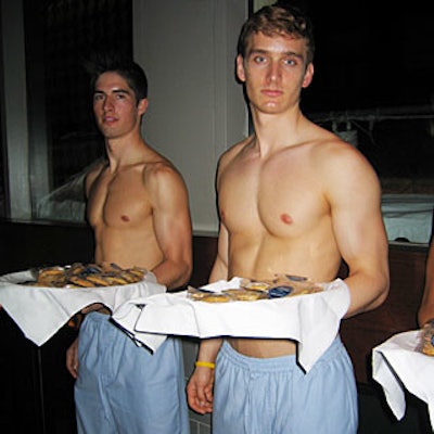 Shirtless, pajama-pants-clad caterwaiters from Andy King Events offered cookies from trays.