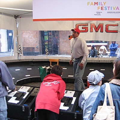 Event cosponsor GMC created a kid-pleasing, parent-tempting display. Kids could play with a remote control racetrack for model GMC racers while their parents checked out model cars on display.