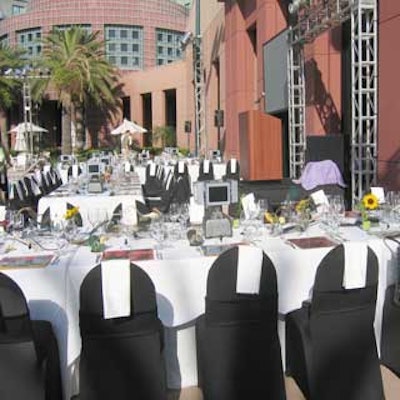 Chairs were covered in black fabric and then draped with small pieces in white to resemble piano keys.