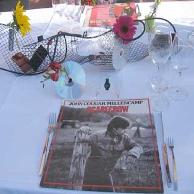 Vintage album covers served as charger plates at the Orlando NACE Decades of Rock & Roll Cigar Dinner.