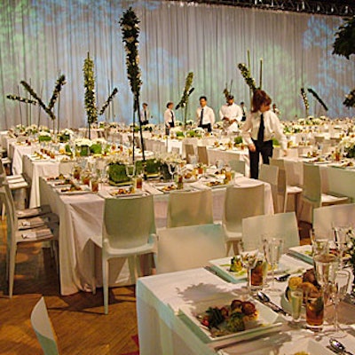 Simple white linens covered square tables.