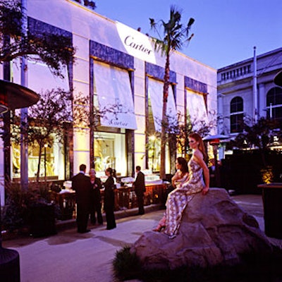 Models wearing Cartier jewels and animal-print gowns posed on fake boulders outside Cartier's Beverly Hills store, which was transformed into the Tanzanian national park in honor of the Paris-based jeweler's 25th anniversary in Los Angeles.