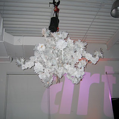 Black and white chandeliers from Troy hung from the ceiling.