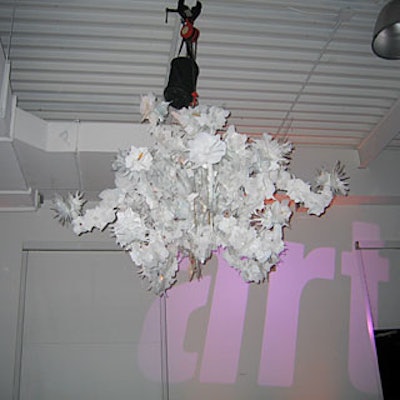 Black and white chandeliers from Troy hung from the ceiling.