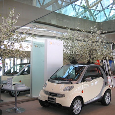 Event sponsor Mercedes-Benz had several Smart cars set up in the event space, each accented with florals by Church Street Flowers.