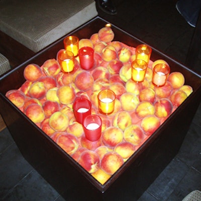 Peaches filled Lucite cocktail tables by JMVisuals.