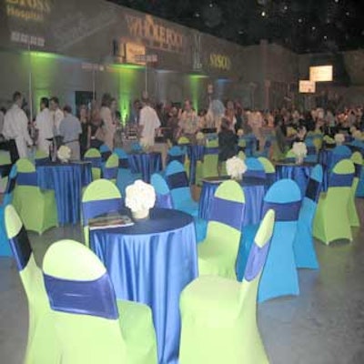 Tables covered in deep sea blue and lime green were scattered throughout the general tasting area.
