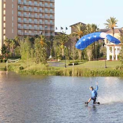 Skydivers from the Aerial Entertainment Team landed in the lake behind the JW Marriott Orlando Grande Lakes Resort and performed a stunt called toe-dragging until they reached land.