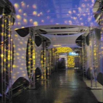 Guests walked through a shimmering, spandex-lined hallway designed by conceptBAIT.
