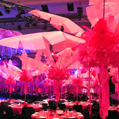 Oversize pink feather-and-nylon palm trees decorated each table, helping to create designer Sinclair Russell's tropical paradise.