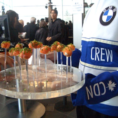 Servers wearing custom-designed pit crew jackets served smoked salmon lollipops at the BMW 3 Series Sedan launch and 3 Series 30th anniversary party at Town & Country BMW.