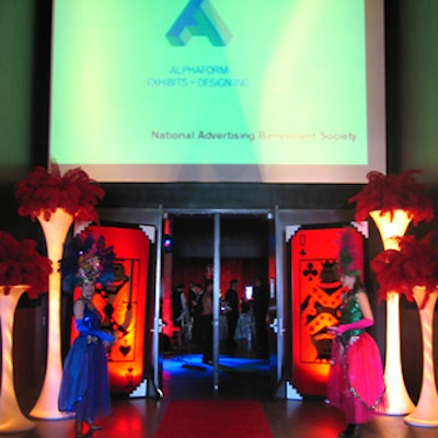 Showgirls in costumes from Malabar Costumes greeted guests entering the party.