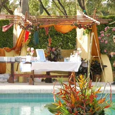 A large arrangement of birds-of-paradise and ginger flowers floated in the pool in front of a stucco market stall at the Doral Golf Resort & Spa during the SITE Foundation Invitational.