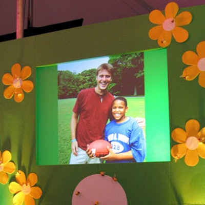 Bestek Lighting & Staging helped to created the brightly colored, flower-adorned stage, as well as the still-frame images of children playing outside, projected throughout the evening on either side of the stage.
